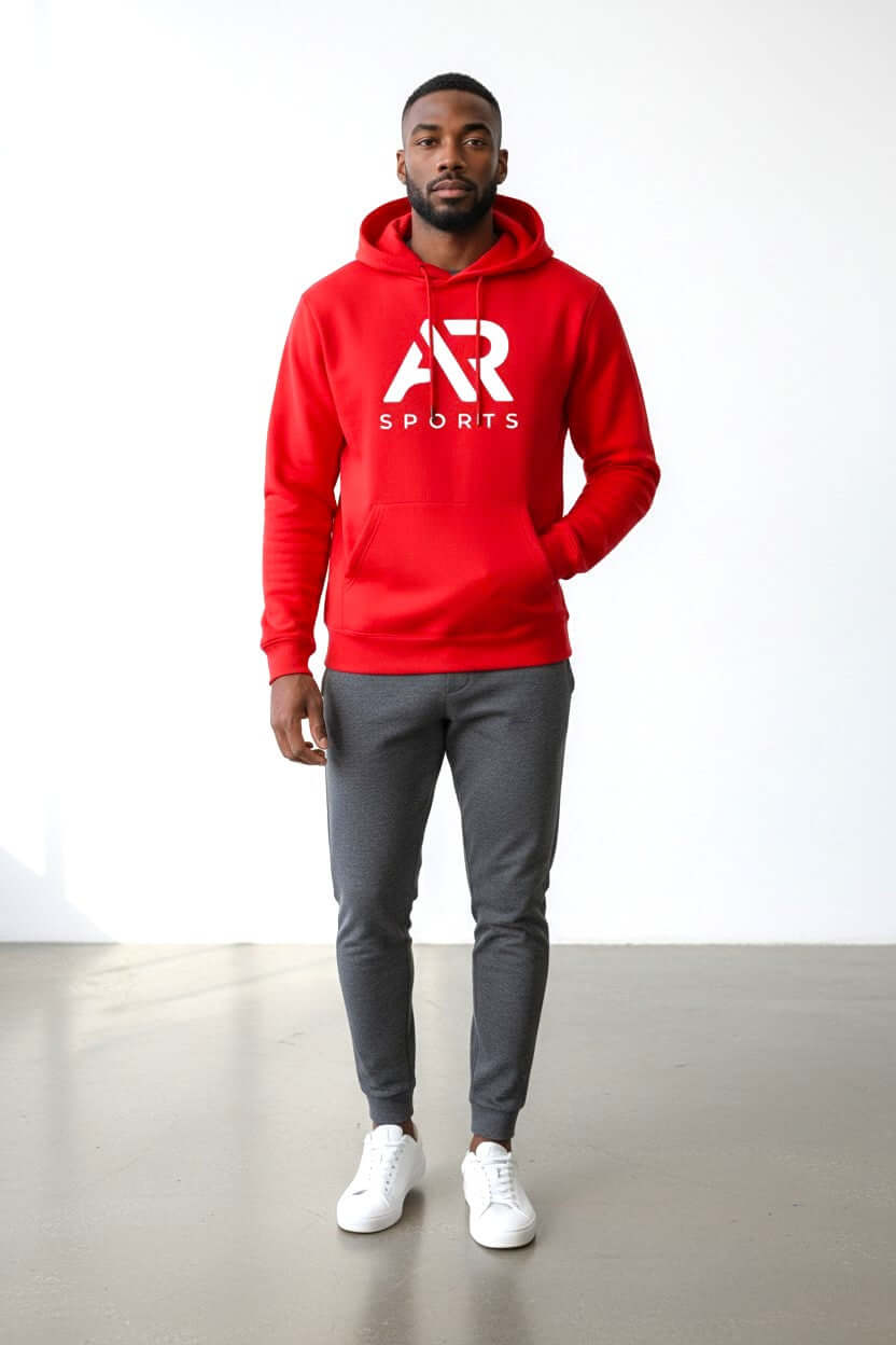Men's Essential Logo Graphic Pouch Pocket Pullover Hoodie in red worn by a man.