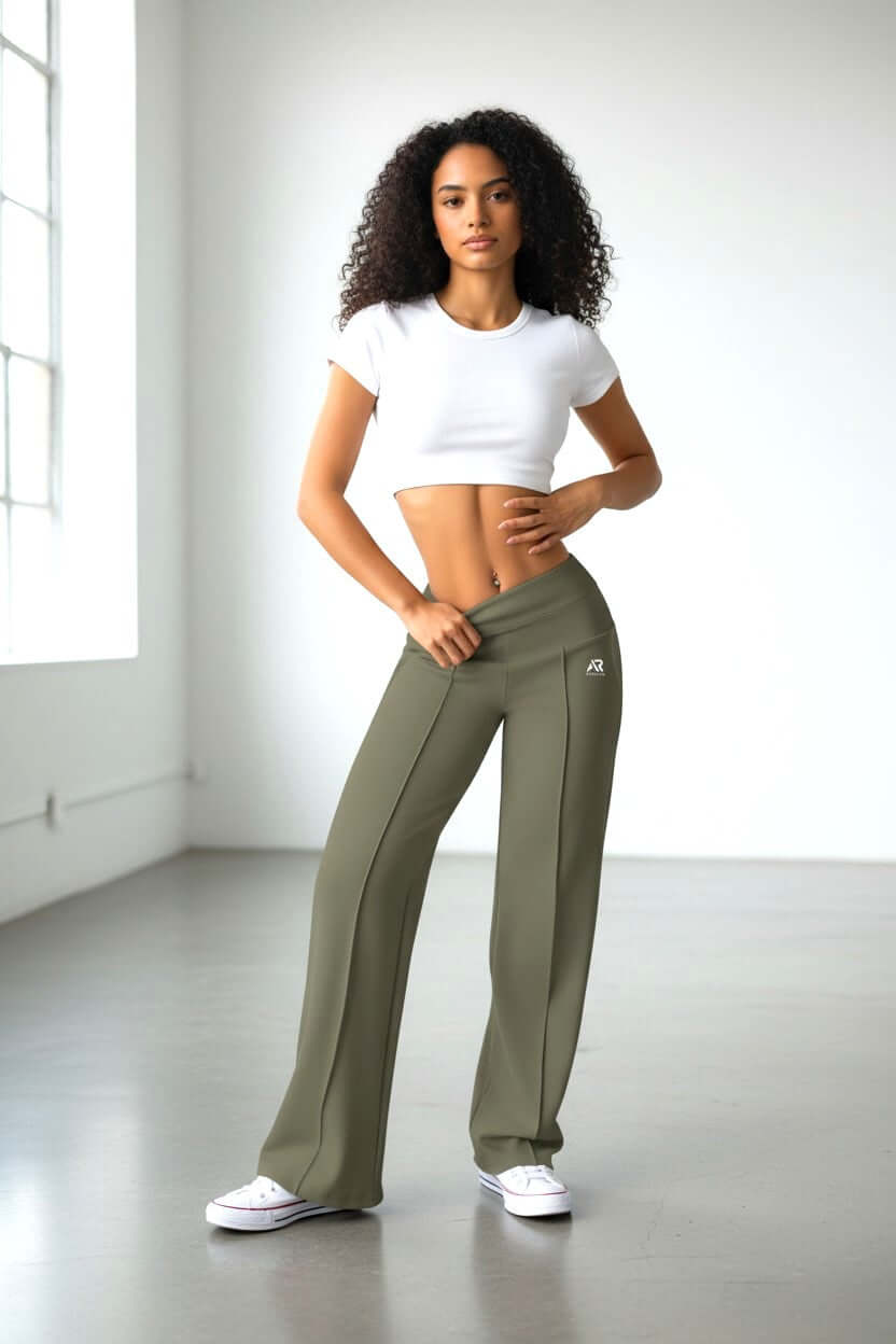 Women in high waist shapewear wide leg pants, showcasing confidence and style in a light-filled room.