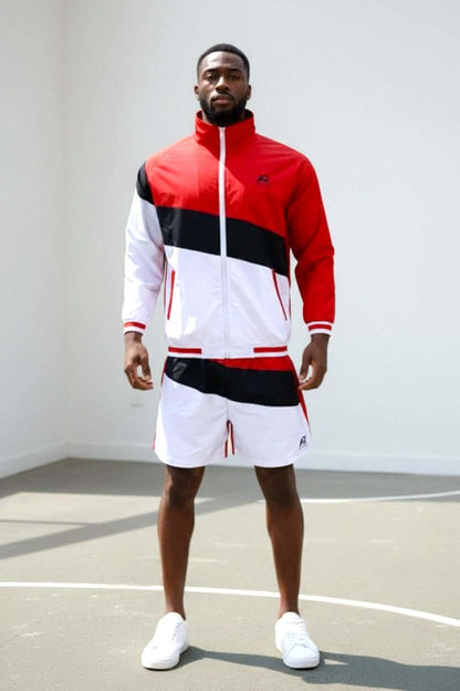 Men's tracksuit windbreaker jacket with matching shorts in red and white.