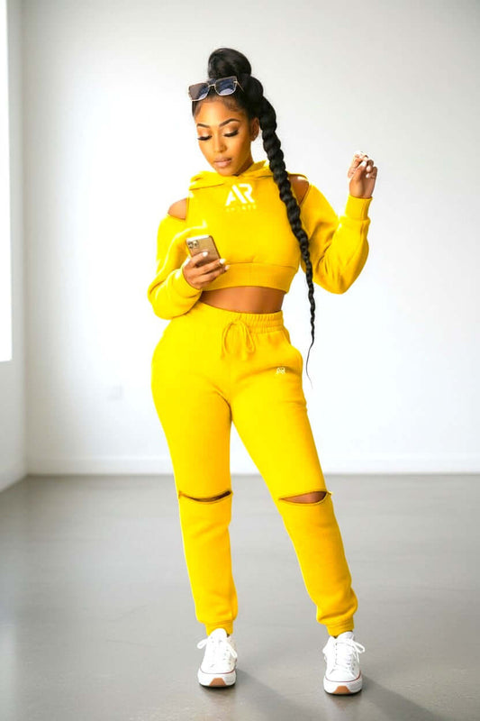 Women in yellow 2Pcs Hoodie Crop Top Pullover Zipper with Matching Pants, stylish and comfortable outfit.