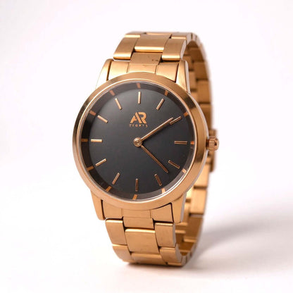 Wristwatch Timeless Rose Gold watch with a sleek black dial and elegant gold bracelet.